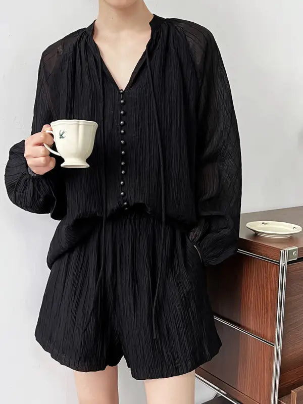 Black textured pajama set featuring a comfy shirt wide and versatile wide leg shorts