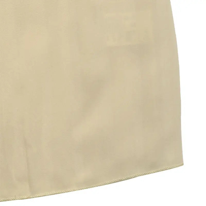 Beige or cream-colored fabric panel with a curved edge.