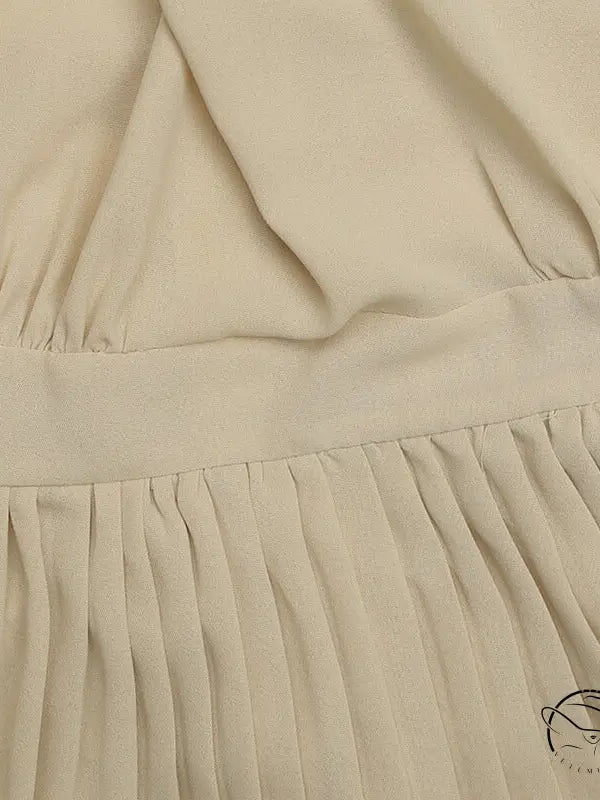 Elegant vacation halter pleated A-line midi dress in beige fabric