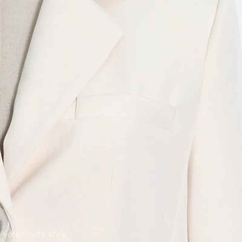 Elegant white simple blazer with lapels, featuring pocket detail, perfect as a button simple blazer
