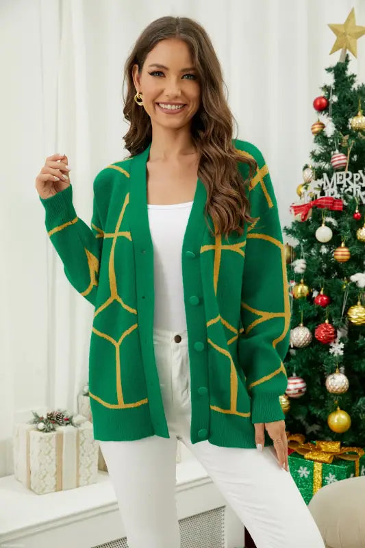 Emerald green contrast color pattern cardigan layered over white outfit for spring fall style