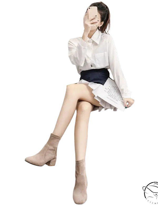 Woman taking selfie in apricot colored velvet fashion suede boots