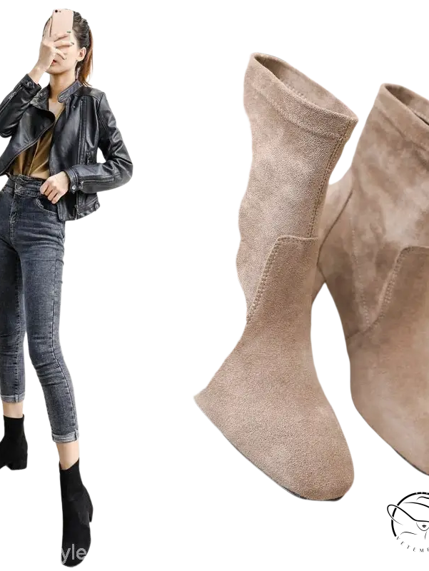 Pair of beige suede ankle boots with block heels and apricot colored velvet