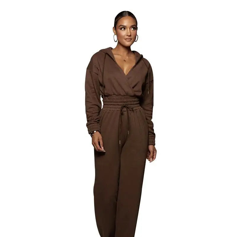 Fashionable sweater suit with open v trousers and fitted design worn by a woman