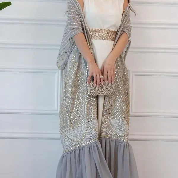 Elegant fashionable urban casual maxi dress with white bodice and intricate beadwork
