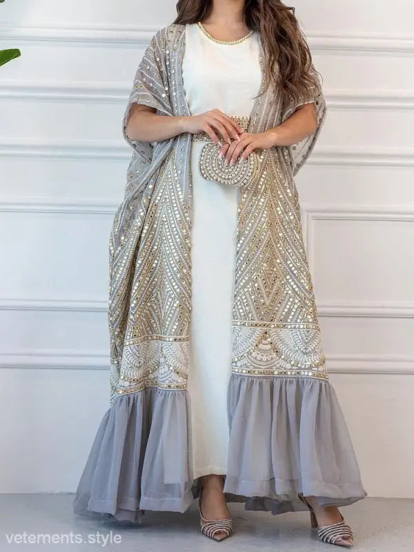 Elegant long white dress with ornate gray and gold embroidered open robe overlay for fashionable urban casual style