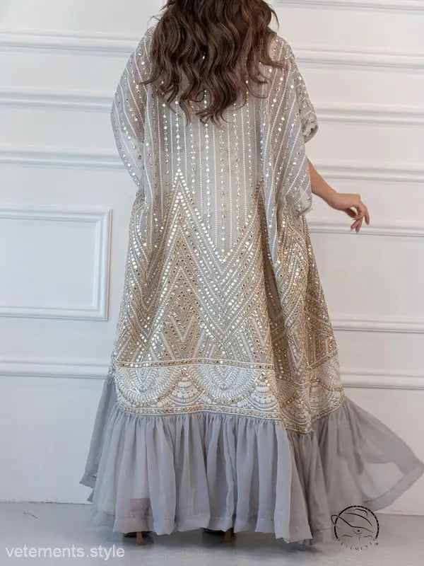 Fashionable urban casual maxi dress with ornate beading and flowy chiffon skirt
