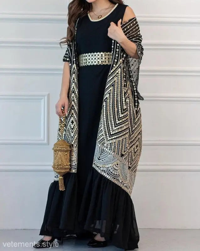 Elegant black abaya dress with geometric cardigan and gold belt for fashionable urban casual style