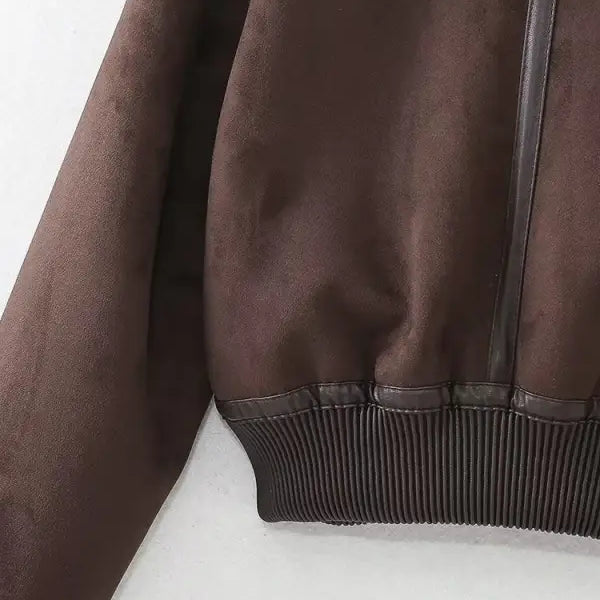 Brown leather bomber jacket with ribbed waistband, ideal as a faux shearling jacket for fall and winter wear