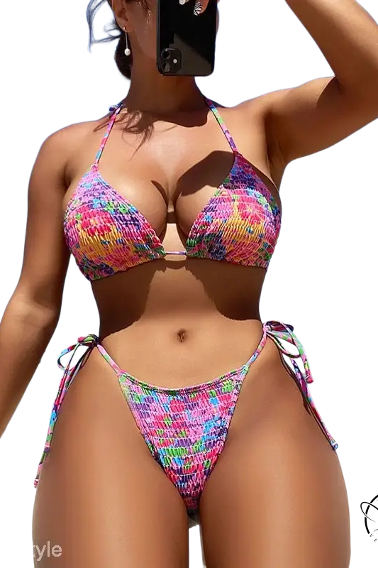 Vibrant floral Brazilian bikini with boho smocked halter top and tie-side bottom