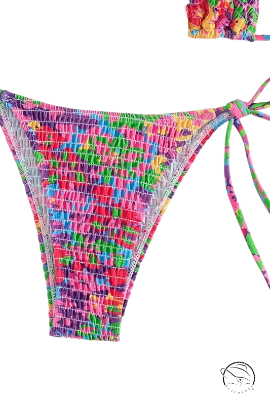 Vibrant floral Brazilian bikini bottom with smocked tie-sides