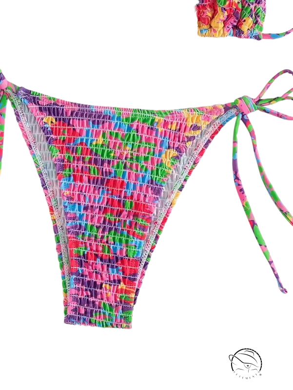 Vibrant floral Brazilian bikini bottom with smocked tie-sides