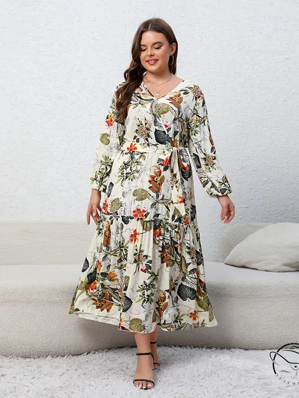 Woman in floral loose swing dress with long sleeves and v-neckline