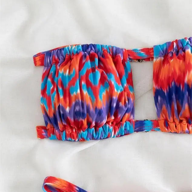 Colorful tie-dye patterned floral primary color printed bikini top with vibrant hues