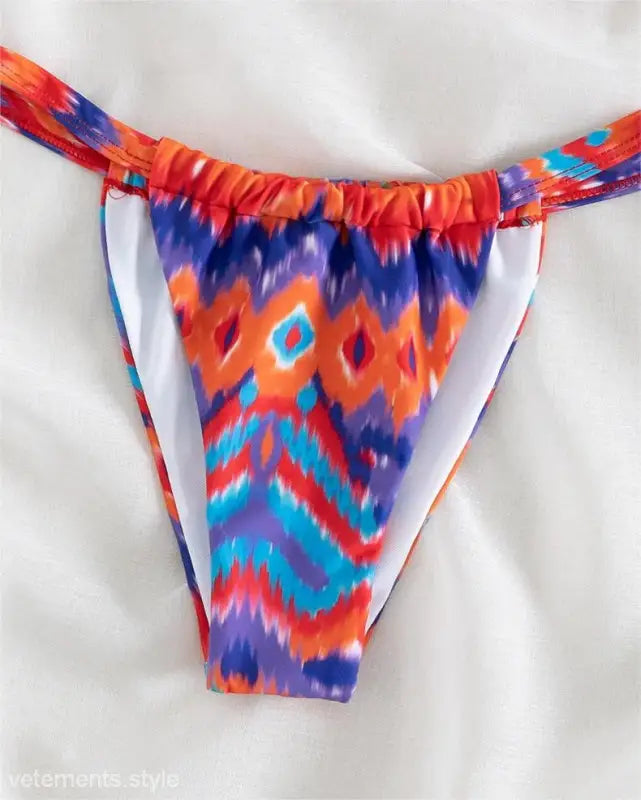 Colorful ikat-style bikini bottom with floral primary color print and free shipping