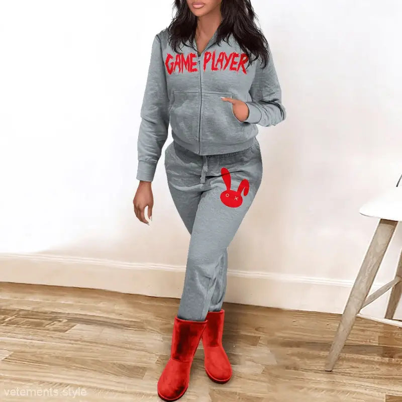 Gray tracksuit with GAME PLAYER text and red bunny graphic styled with red boots