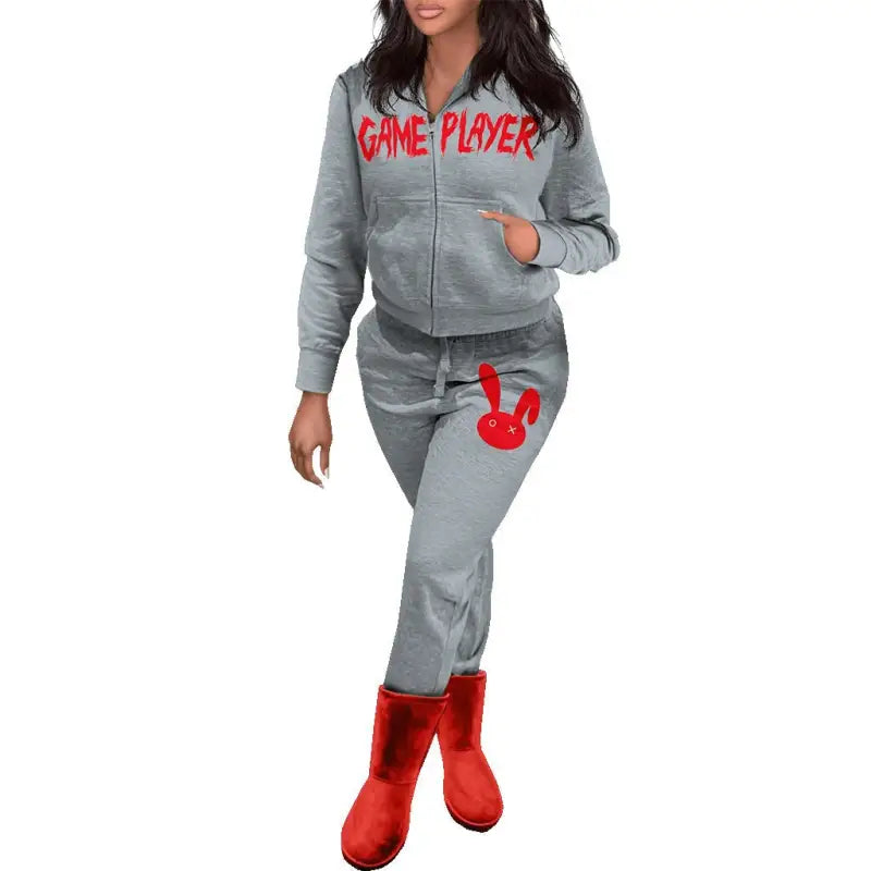 Gray tracksuit with GAME PLAYER text and red bunny graphic, paired with red boots