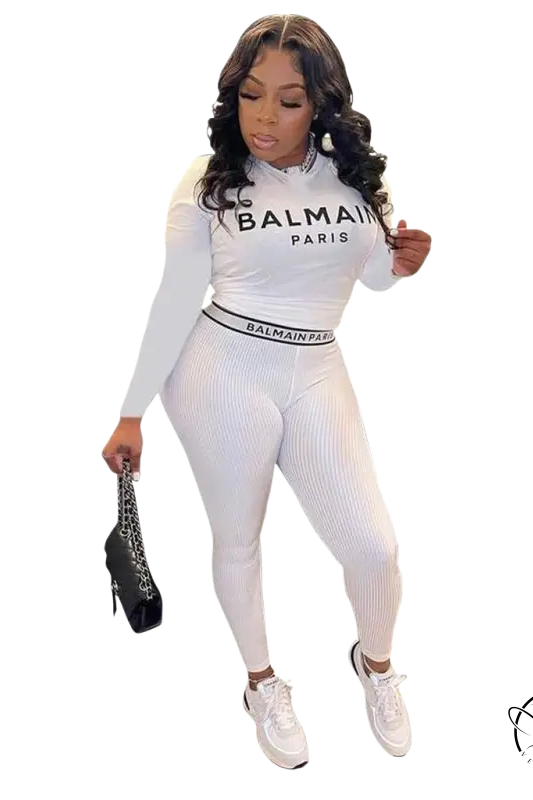 Woman in white Balmain pantsuit from floral unique two piece set