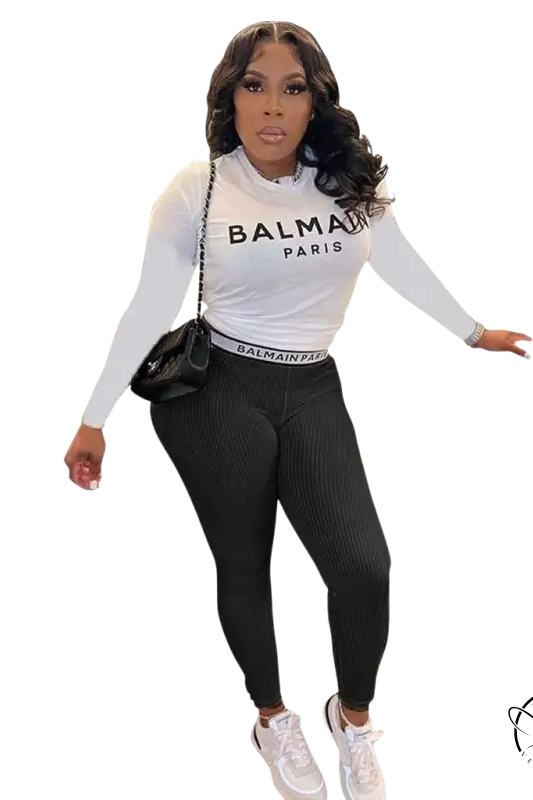 Woman in floral unique two piece set: slim long sleeve top and pants