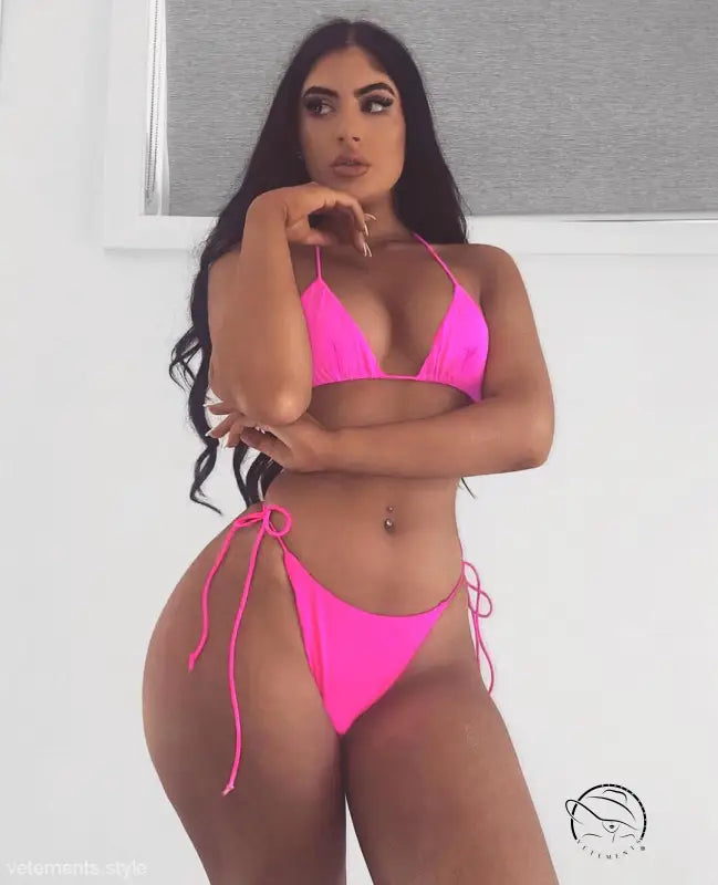Woman in fluorescent yellow sexy bandage bikini with cameo brown hair