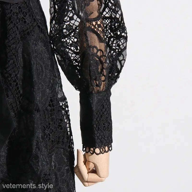 Black lace garment with intricate crochet patterns and long sleeves from French Royal Embroidered Dress
