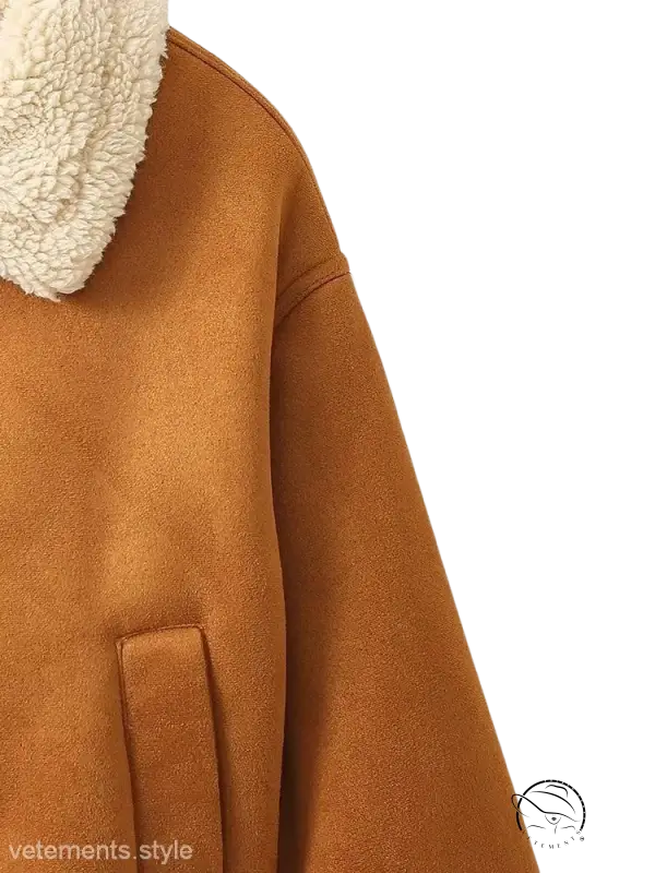 Tan French short jacket with shearling lining and plush white fleece collar