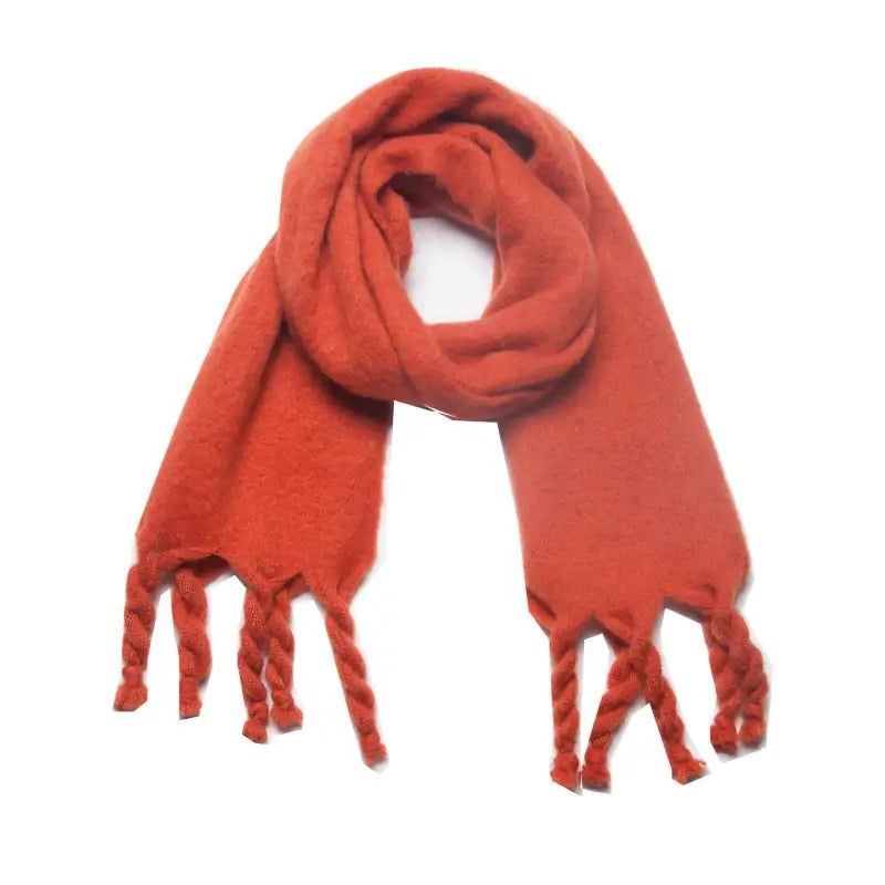 Orange knitted wool scarf with tassels, perfect for winter wear and stylish warmth