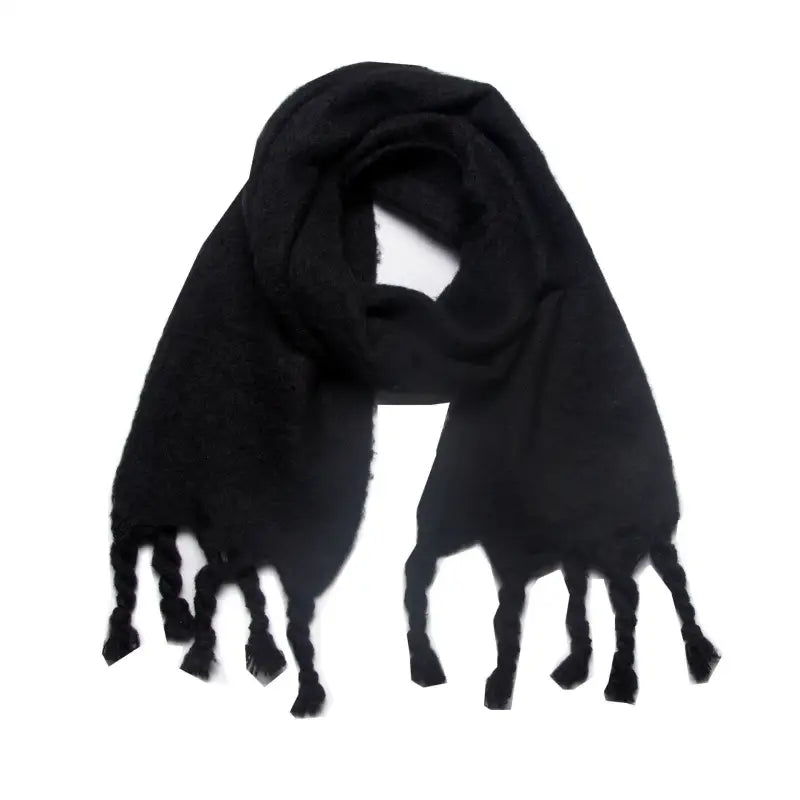 Black fringed wool scarf perfect for winter wear, enhancing style and warmth
