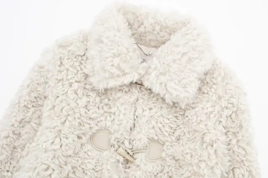 Cream-colored faux fur coat with toggle closures for cozy winter nightout furry jacket
