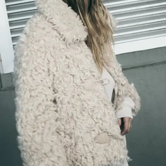 Cream-colored textured toggle-closure jacket, perfect for a nightout furry jacket