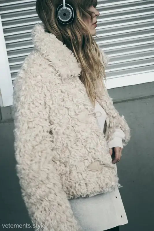 Cream-colored textured toggle-closure jacket, perfect for a nightout furry jacket