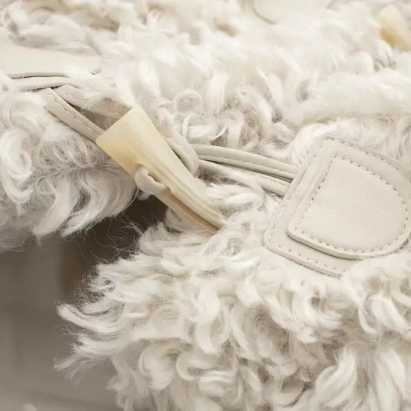 White fluffy bag with toggle closure for stylish nightout furry jacket in winter