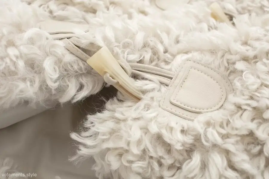 White fluffy bag with toggle closure for stylish nightout furry jacket in winter