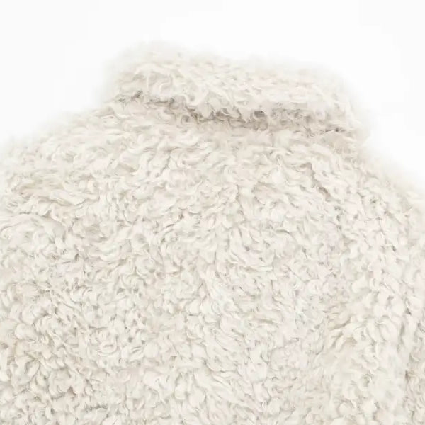 Furry short jacket in light color, ideal for nightout in fall and winter seasons
