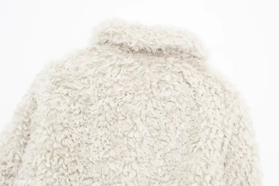 Furry short jacket in light color, ideal for nightout in fall and winter seasons