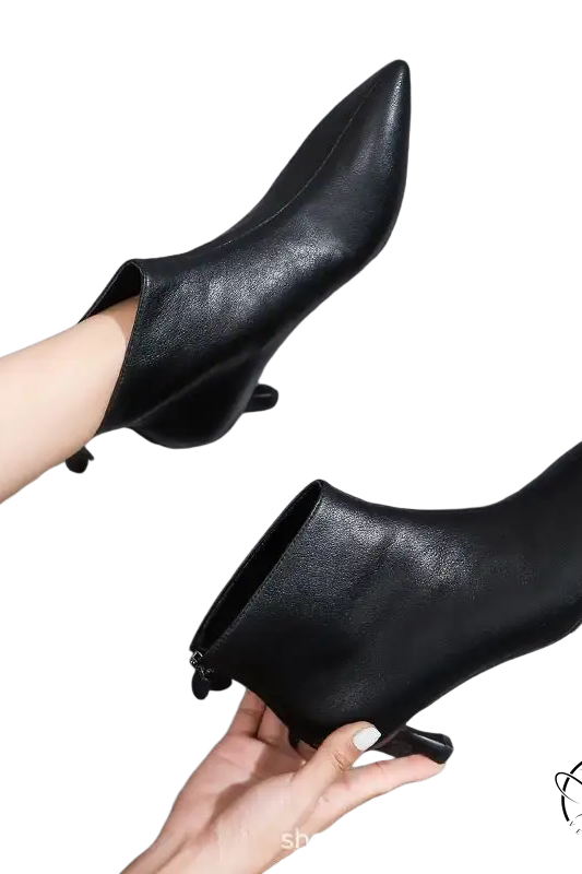 Black leather short boots for women with pointed toe and low heel