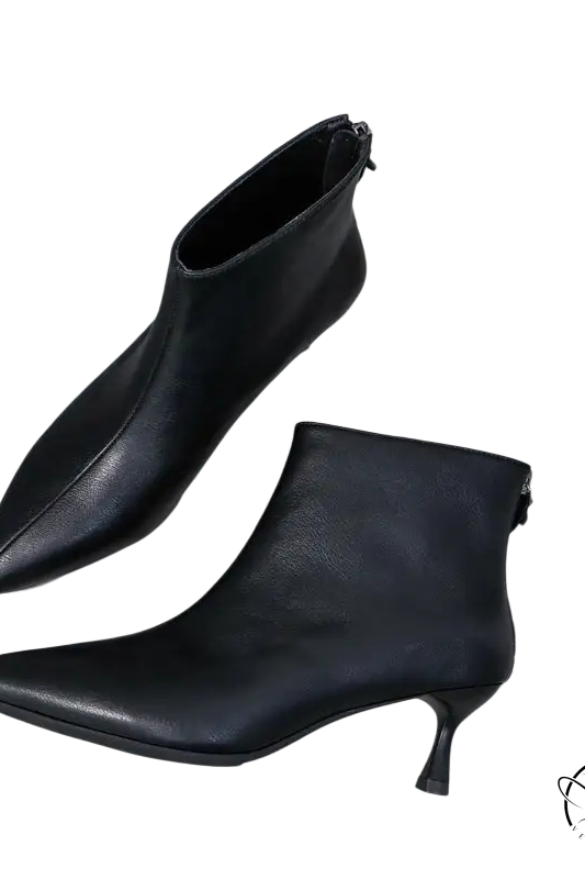 Stylish black leather short boots with pointed toe and high heel for winter