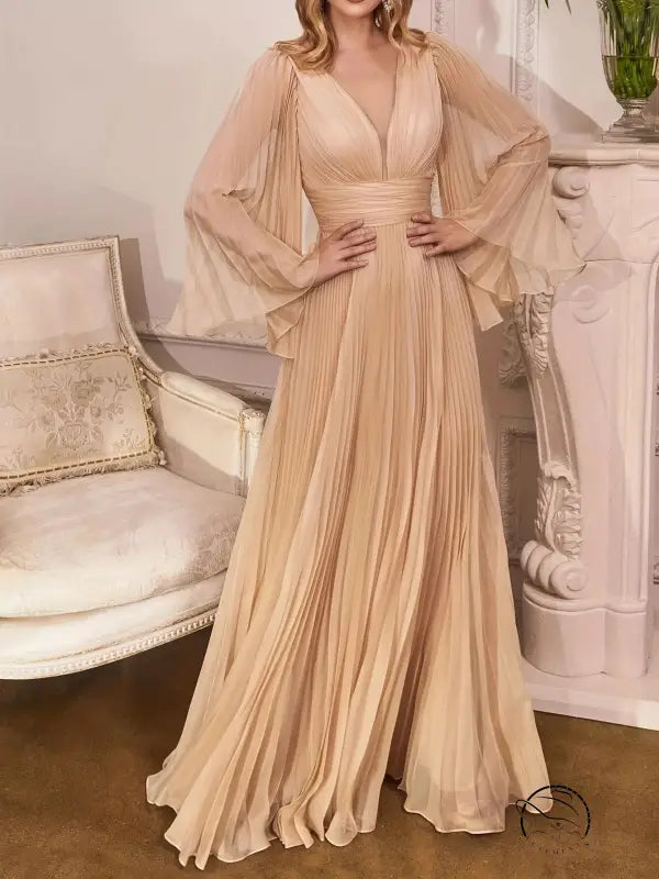 Gorgeous evening dress with elegant pleated gown and flowing trumpet sleeves