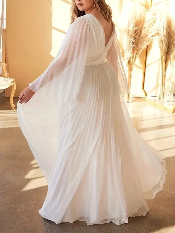 Flowing white pleated dress from gorgeous evening dress collection with elegant trumpet sleeves