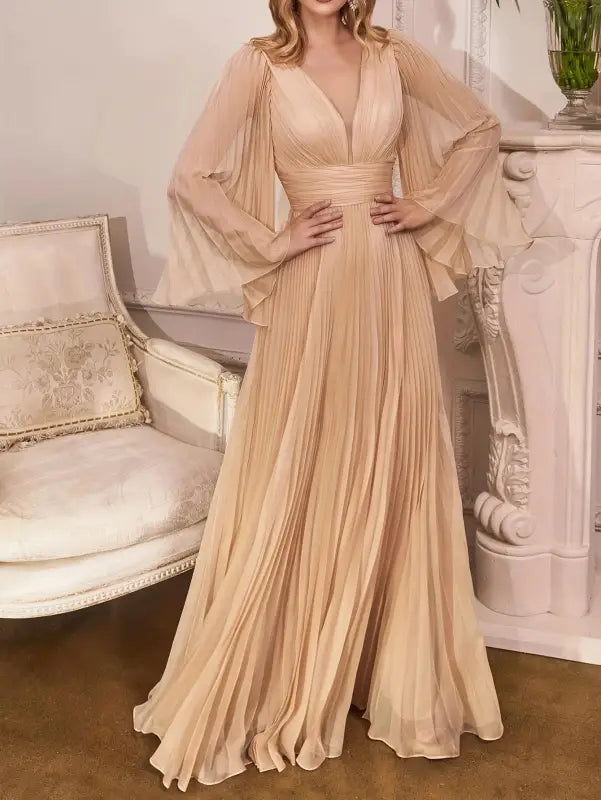 Elegant pleated gown with flowing sleeves, part of a gorgeous evening dress collection