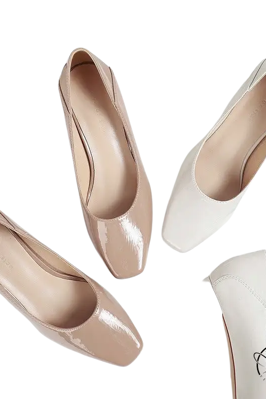 Three pairs of gorgeous high heel leather shoes in neutral colors