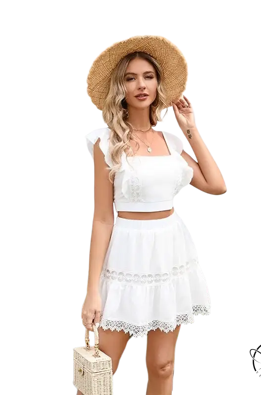 Woman in gorgeous Miami set: white skirt two piece with straw hat