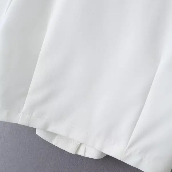 White fabric garment from Gorgeous Yacht Fit Crop Top with Button and Pocket Detail