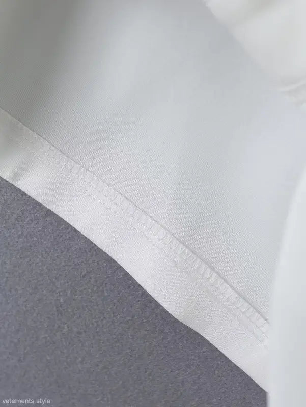 White fabric with textured edge from Gorgeous Yacht Fit Crop Top featuring high waist design