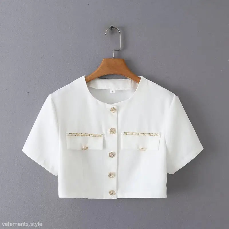 White cropped blouse with gold chain detail from the gorgeous yacht fit collection