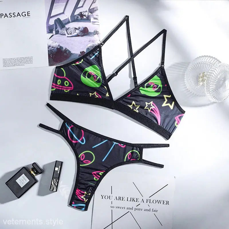 Black bikini set with colorful alien and space-themed patterns from Graffiti Printing Lingerie collection