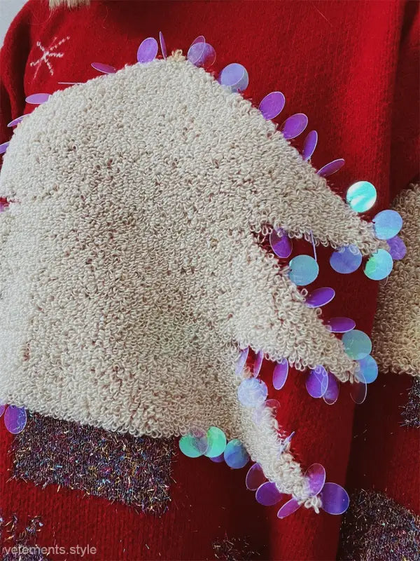 Handmade Christmas sweater with colorful sequin details and fluffy white knit fabric