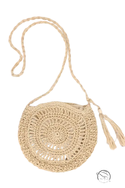 Handmade crochet bag in beige with light brown bow knot and tassel strap