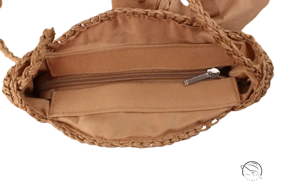 Handmade crochet bag with tan woven straw, zipper, and light brown bow knot