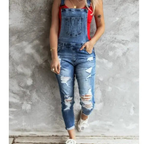 Women wearing Hanna Stretch Denim high rise overall trousers with a red tank top and white sandals